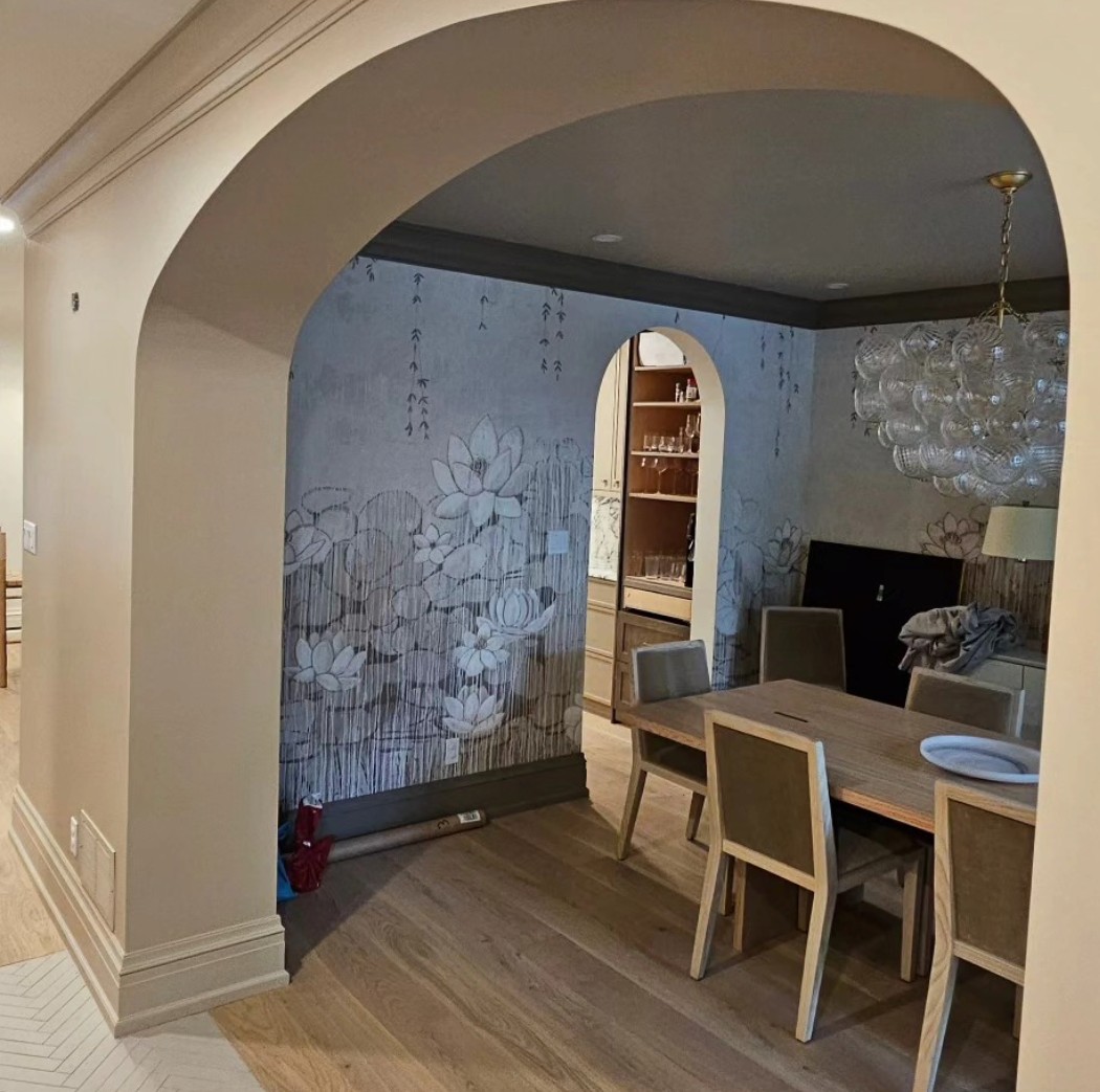 Painted archway opening into a dining room